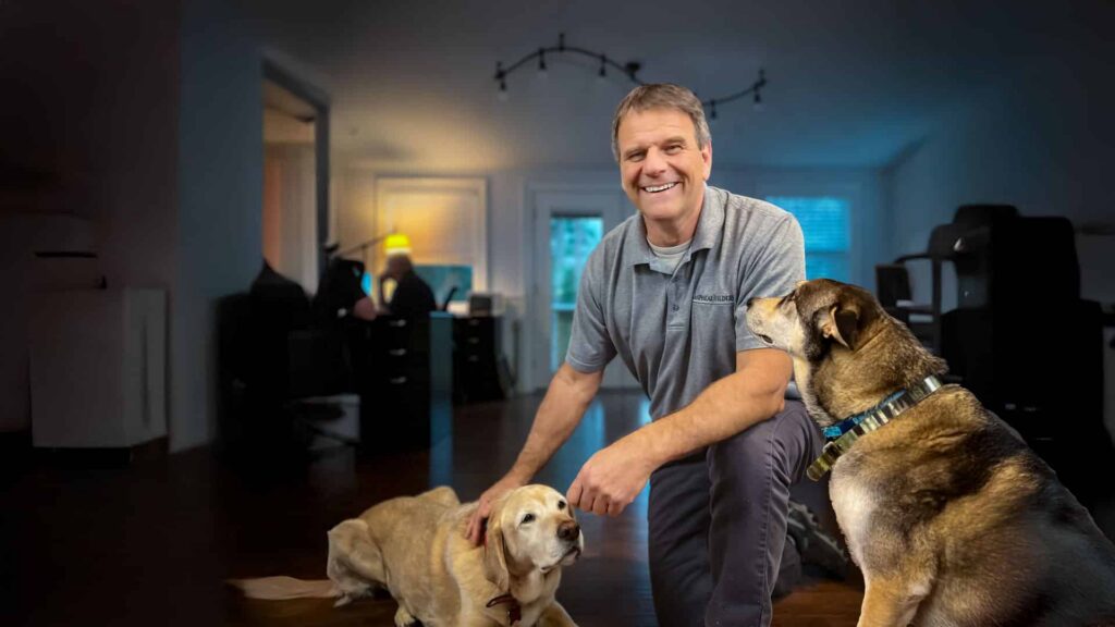 Trevor Lanphear, owner of Lanphear Builders Inc., with 2 of his best Friends